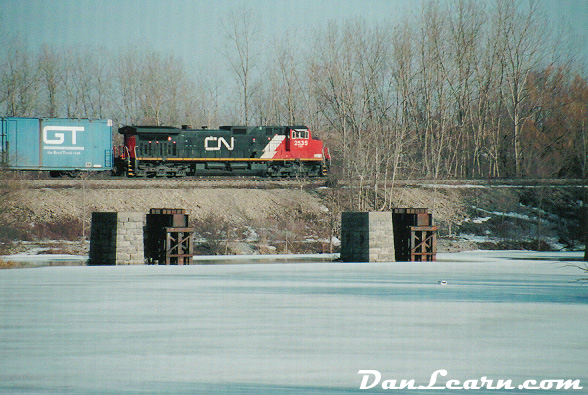 CN train passing Welland River
